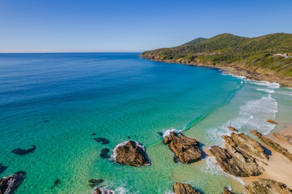 Natural rock pools with turquoise water at low tide