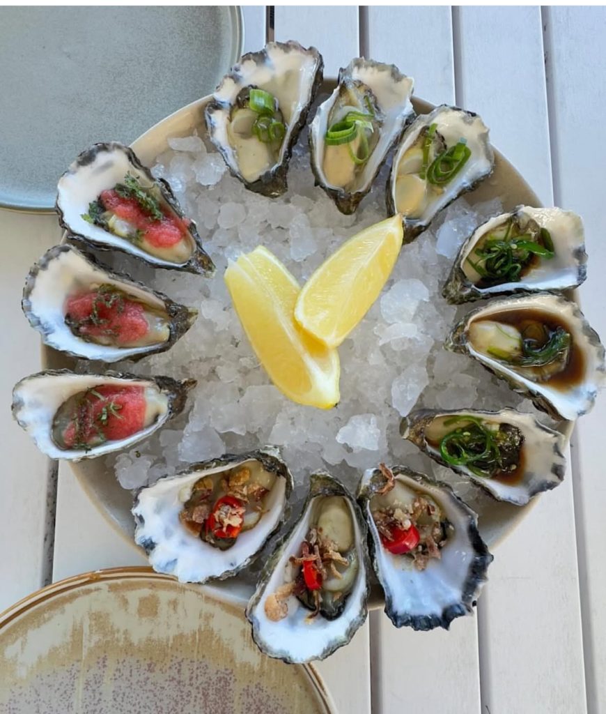 Seafood platter with oysters and lemon wedges at Thirty Three Degrees