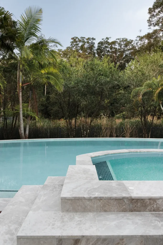 Heated spa surrounded by tropical gardens at Blueys Retreat